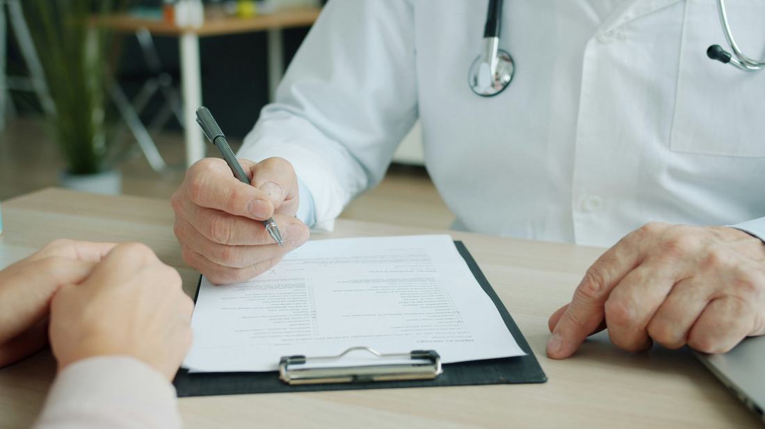 Physician reviewing a patient's medical history